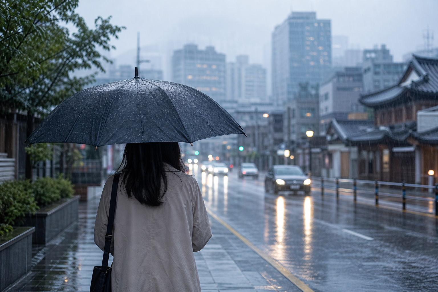 Image representing an umbrella and a rain-soaked street